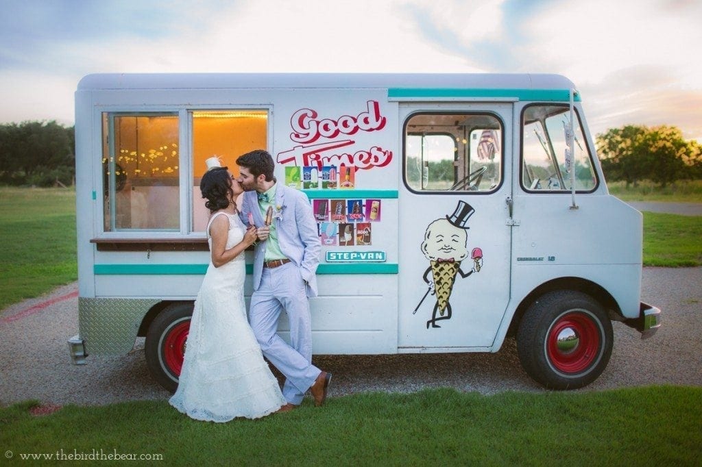 Bride and groom get ice cream from Cool Times Ice Cream truck at their wedding reception.