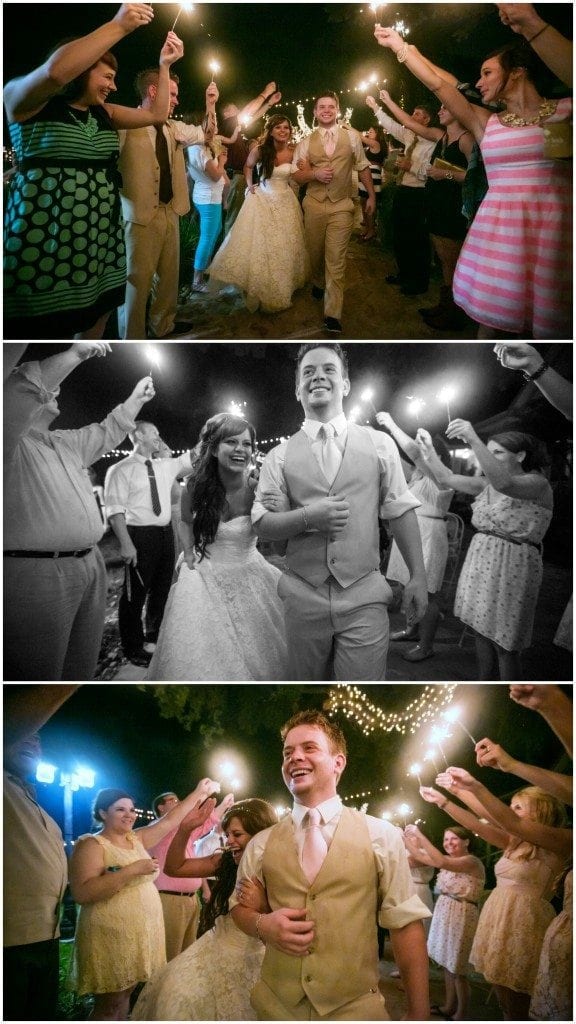 Bride and groom run through sparklers as they exit their Oak Tree Manor wedding reception.