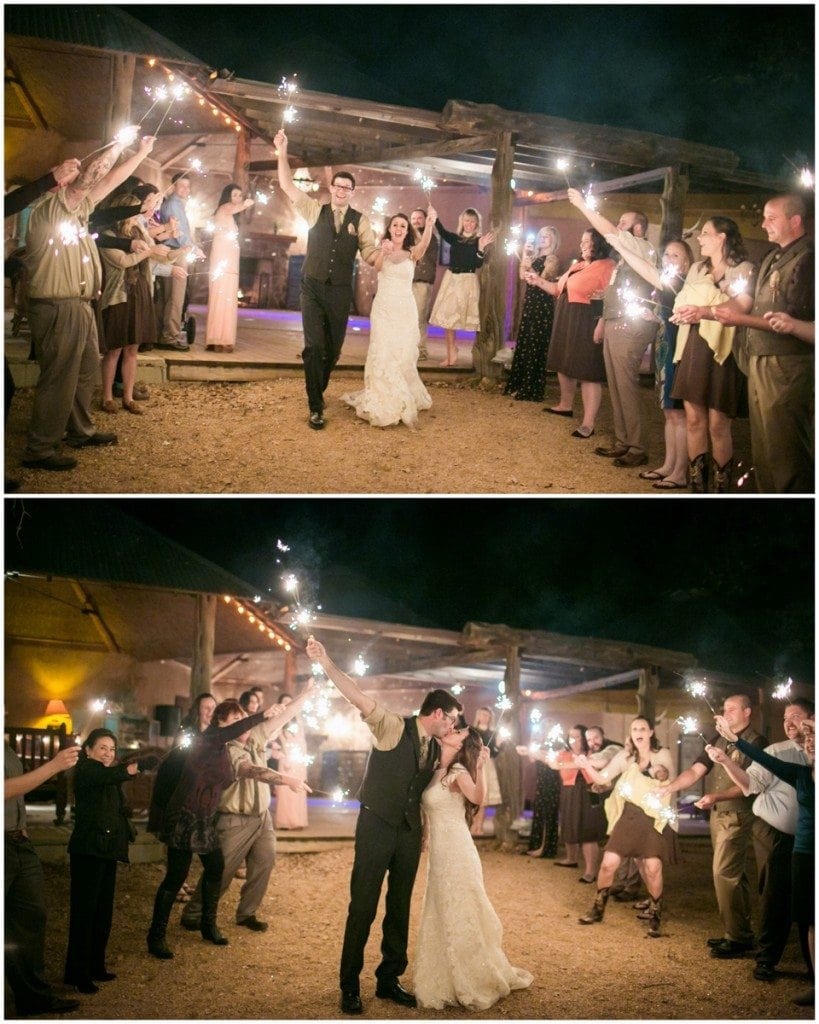 The bride and groom run through a crowd of sparklers after their wedding at Three Points Ranch.