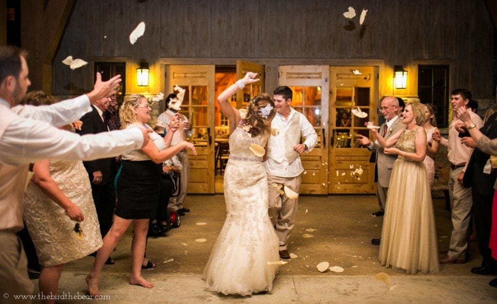 Wedding guests throw tortillas at the bride and groom as they exit their wedding.