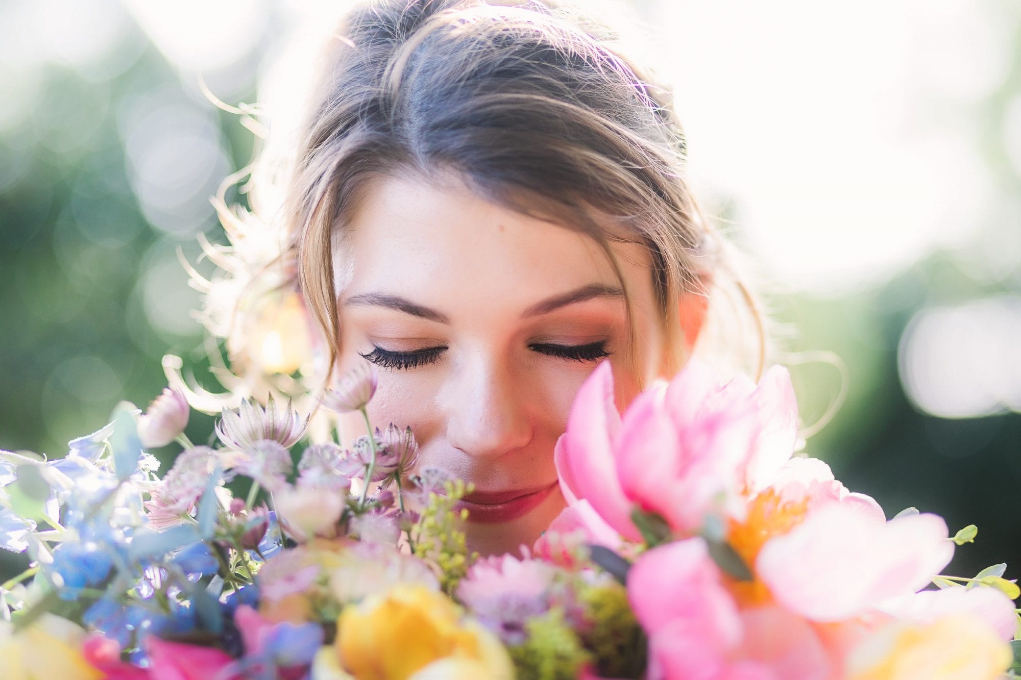 Photograph of Bride smelling her flowers