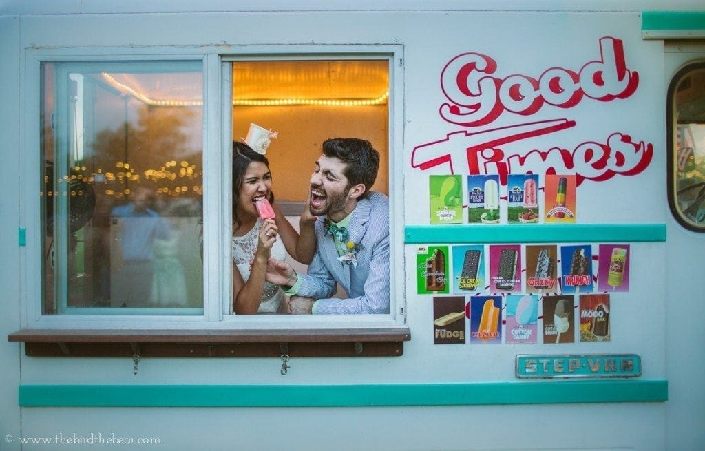 Bride and groom eat ice cream at their pecan springs ranch wedding receptoin