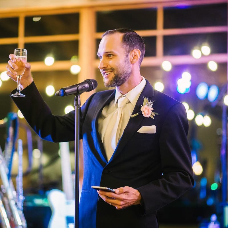 Best man gives toast at wedding reception