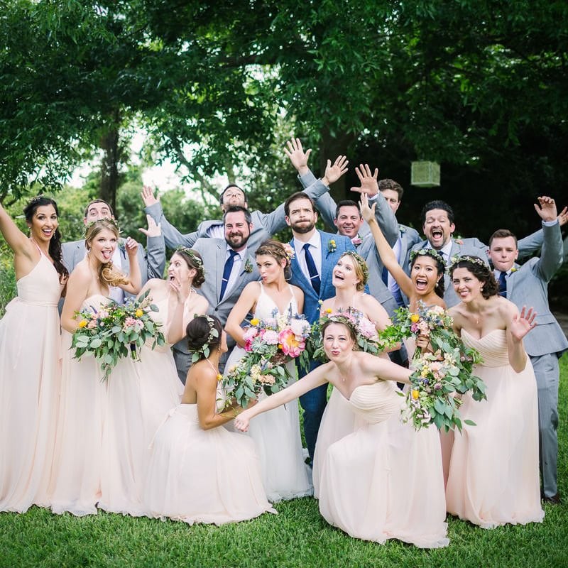 Bridal party makes silly pose for a photo