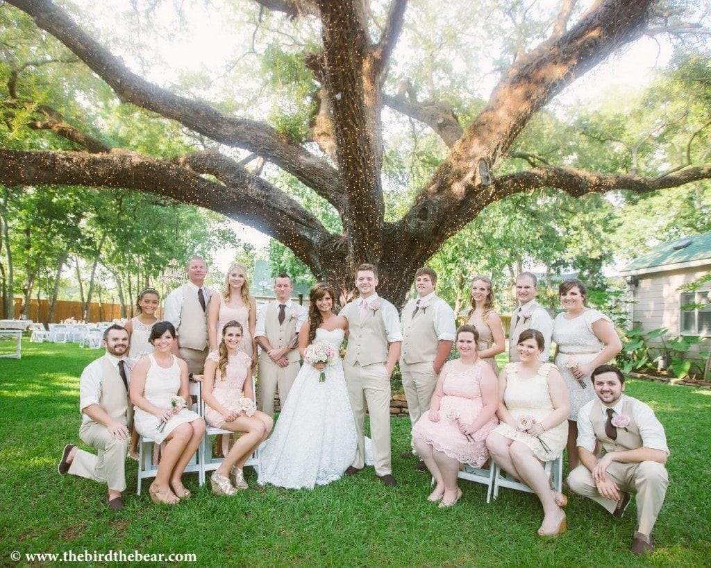 Bridal party under the large Oak tree at Oak Tree Manor in Spring, TX. 
