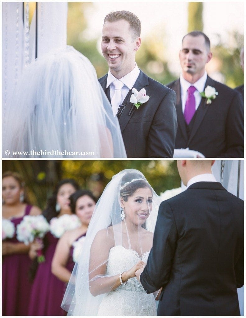 Bride and groom face each other while they say their vows during their wedding ceremony at Park Winters in Winters, CA. 