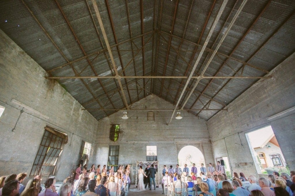 Wedding ceremony in the barn at Olde Dobbin Station in Montgomery, TX. 