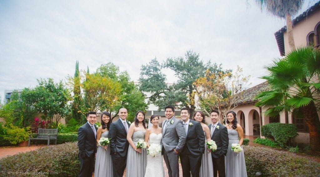 Bridal  party smiles outside of the Parador in Houston, TX. 