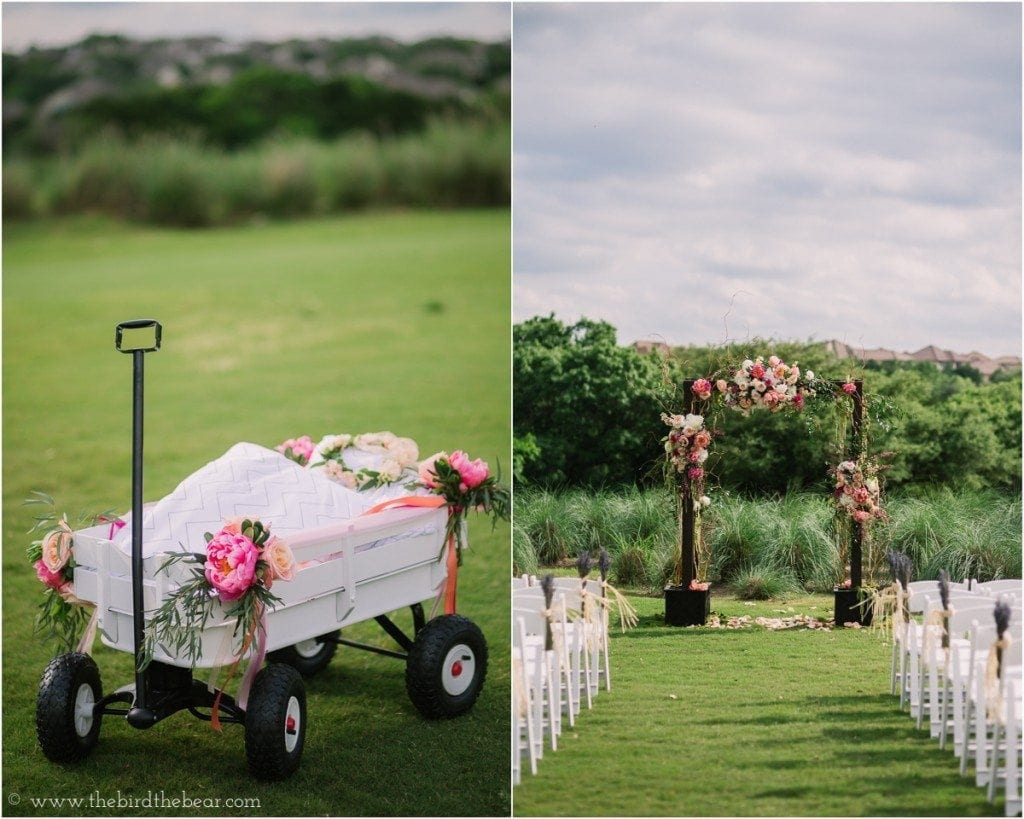 Wagon for a baby flower girl to ride in, decorated with bright pink flowers.