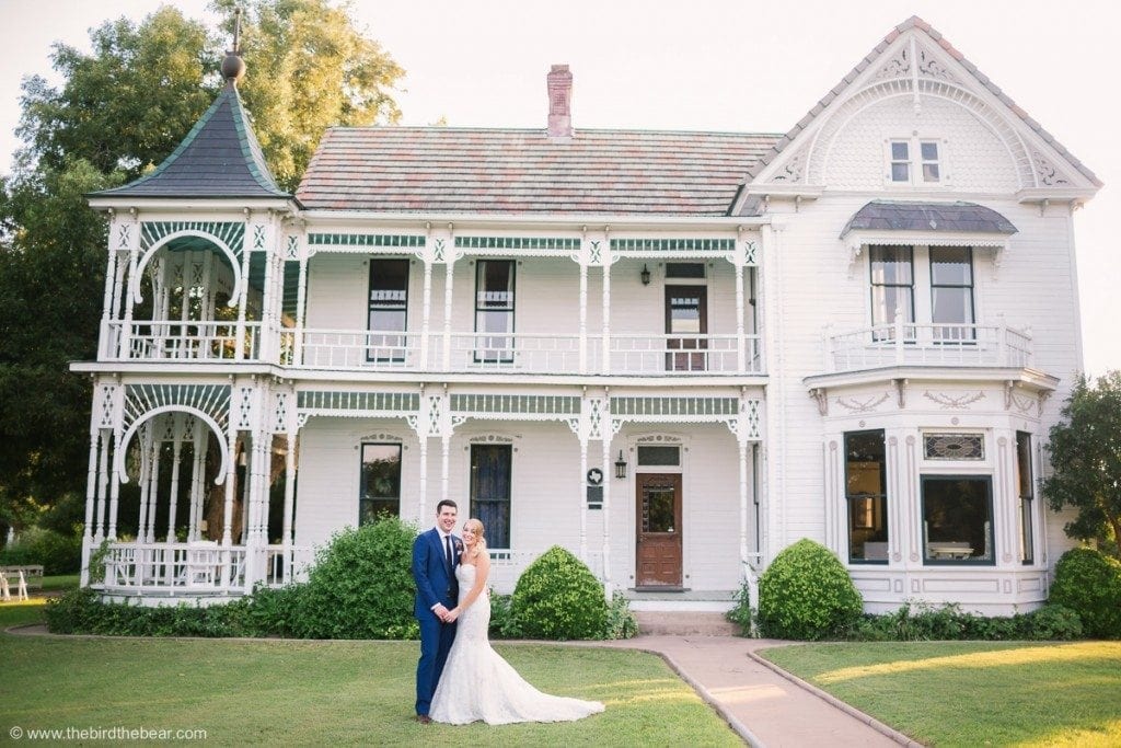 Bride and Groom in front of gorgeous mansion