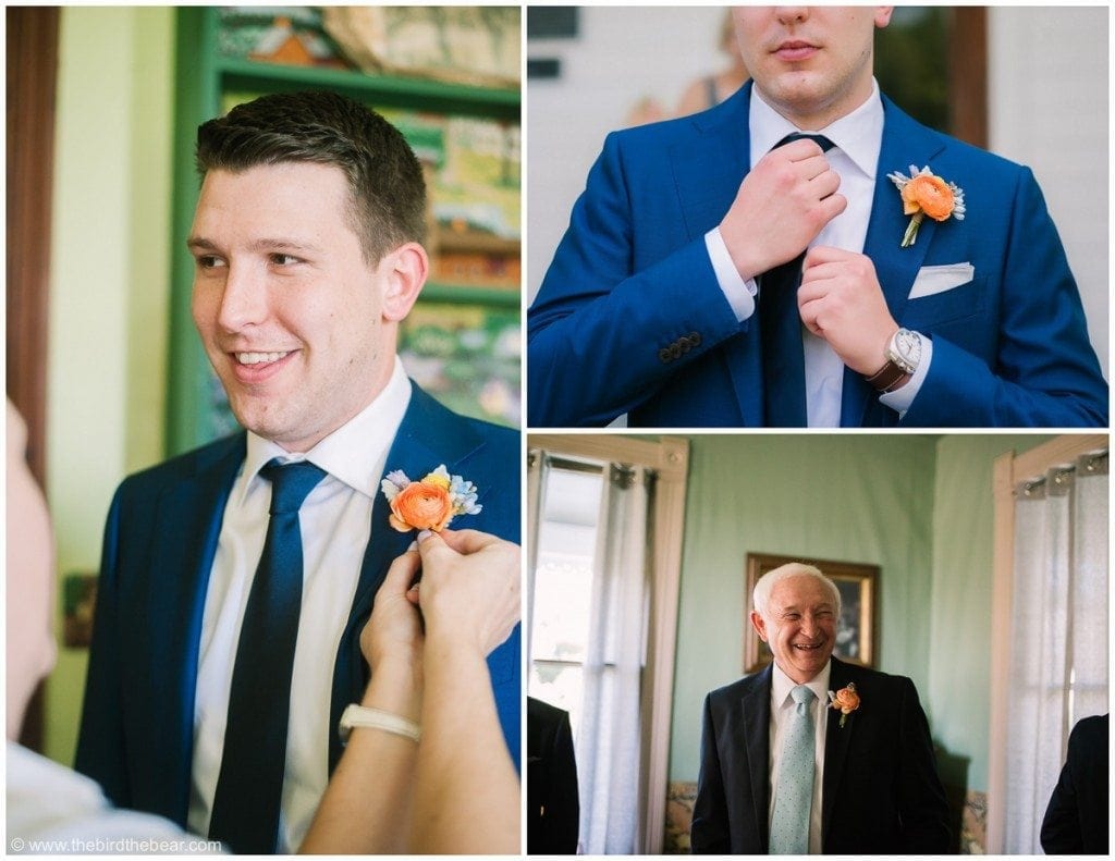 Groom getting his boutineer pinned on and grandpa smiles