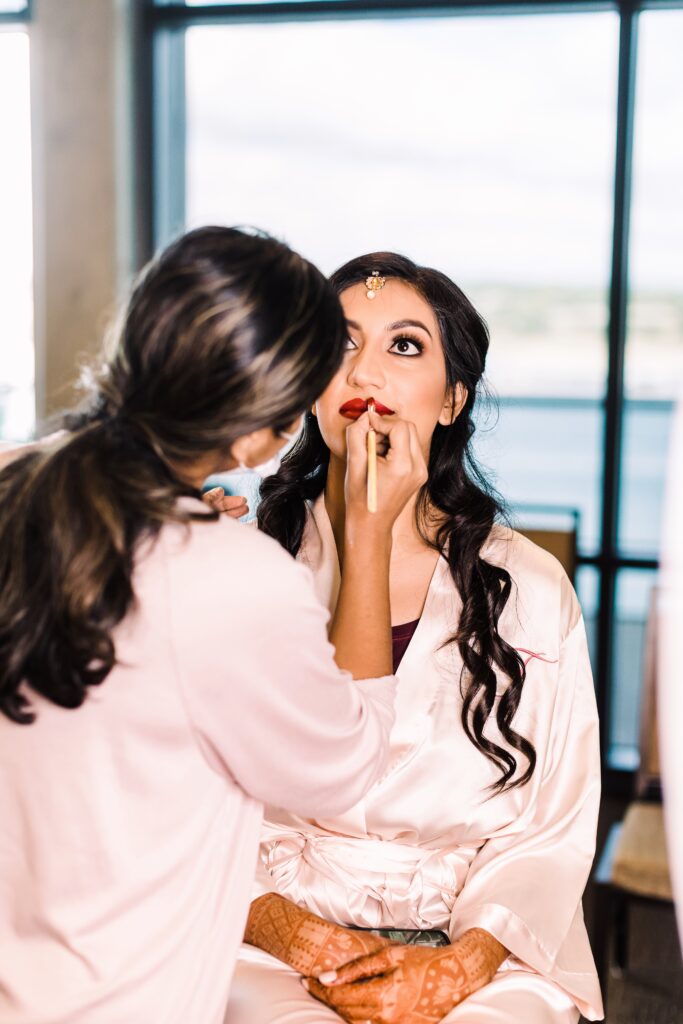 Bride getting makeup done at Lakeway Resort wedding