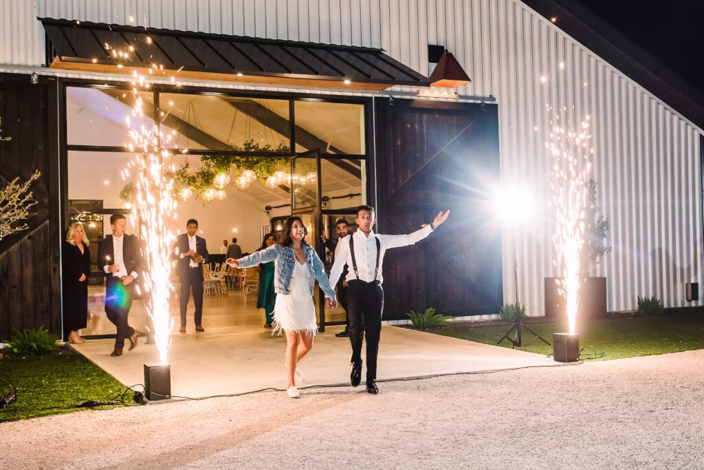 Bride and groom grand exit with cold sparklers at Maes Ridge wedding
