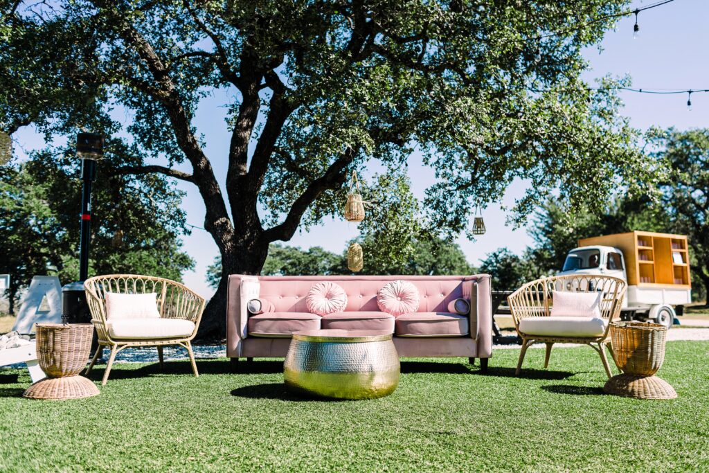 Pink and gold lounge furniture setup at Maes Ridge wedding cocktail hour