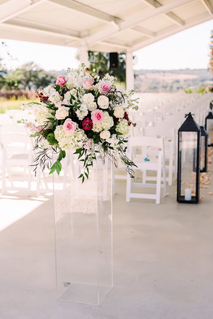 Pink and white floral arrangement at Maes Ridge wedding ceremony